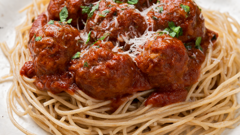 Turkey meatballs in marinara over whole wheat spaghetti topped with basil and Parmesan